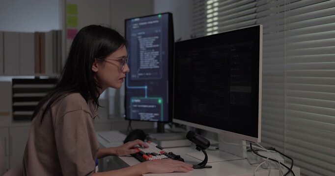  Woman software developer speaking voice prompt to AI assistant chat interface at desk