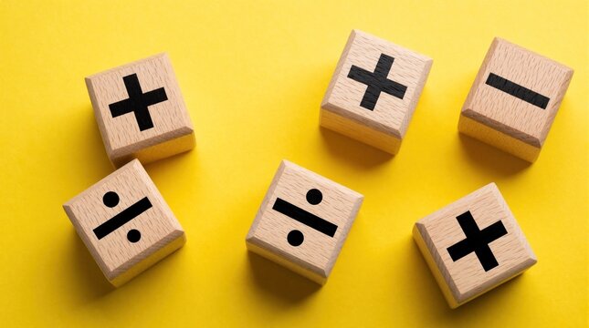 Wooden blocks with math symbols scatter on bright yellow background. Small cubes show plus minus, divide signs for arithmetic. Concept for school education, learning math, business finance, simple