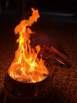 Bright Orange Flames Burning in a Fire Pit During Night Camping