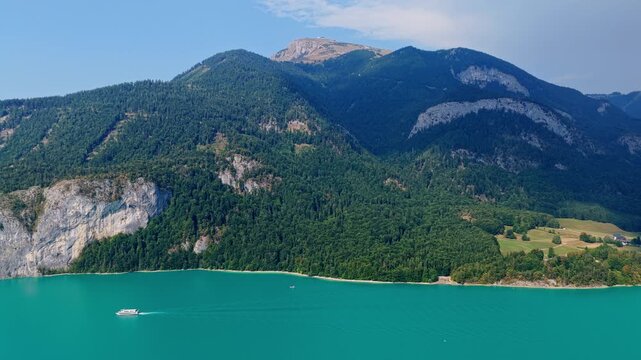 Wolfgangsee lake with mountain landscape. Landscape of mountain peak and Wolfgangsee lake. Nature landscape. Wolfgangsee Lake in Austria. Scenic nature view over Wolfgangsee lake