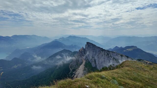 Aerial view of mountain landscape. Landscape panorama. Dramatic misty landscape with mountain in nature environment. Snow mountain peak aerial view. Aerial misty landscape