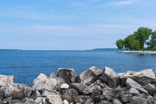 rocky shore of sturgeon bay in door county wisconsin at sunset park