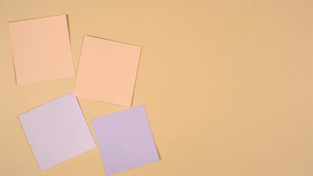 Pastel Paper Squares Scaling Into View on a Peach Background