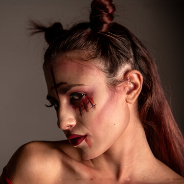 Woman posing with spooky halloween makeup character