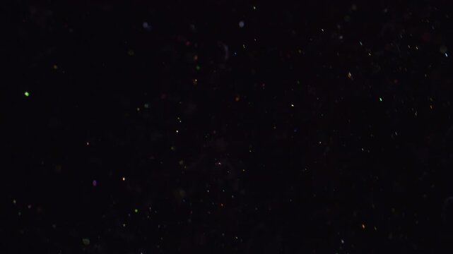 Flare particles flow. Blur shiny sparks. Twinkle particles stream on black night background. Mystic bokeh glow abstract flow blend motion.