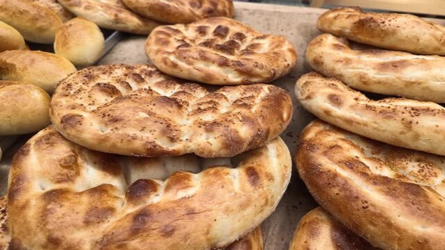 Freshly baked bread displayed at a market stall in the morning