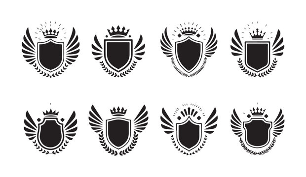 Heraldic shields with crowns wings and laurel wreaths for crest designs.