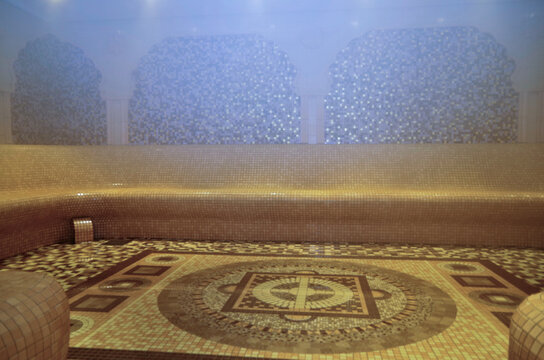 Turkish bath or steam sauna with mosaic tiles inside male locker room of spa or wellness are onboard luxury cruiseship or cruise ship liner