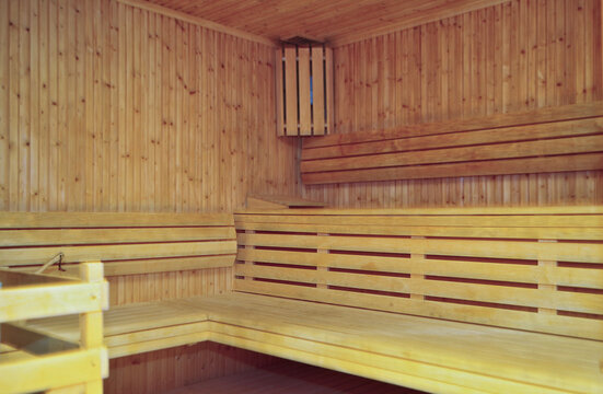 Finnish or dry sauna with oceanview or view of the sea inside male locker room of spa or wellness are onboard luxury cruiseship or cruise ship liner