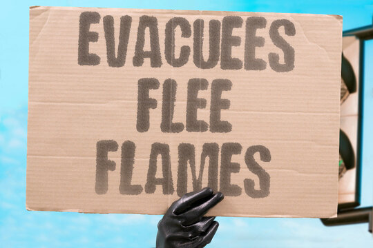 "Evacuees flee flames" Residents rush from homes as a wildfire closes in. EVACUEES. FLAMES. WILDFIRE. EVACUATION. RESIDENTS.