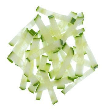 Fresh cucumber strips set isolated on transparent background no shadows with clipping path and full depth of field. Top view flat lay julienne cut vegetable sticks heap