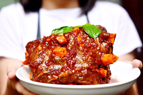 Meat stuffed with carrots on the plate.