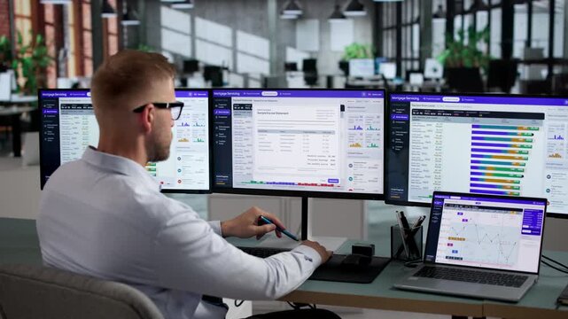 Mortgage Analyst Reviews Loan Servicing Data On Laptop