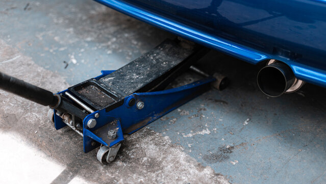 Hydraulic Floor Jack Lifting Car In Garage Maintenance