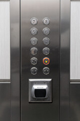 Modern elevator control panel with floor buttons and keycard reader © Rauf