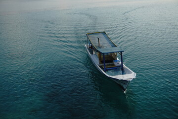 boat on the sea © EmirFaiz