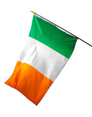 Fototapeta premium Irish flag displayed outdoors during daytime in a public area