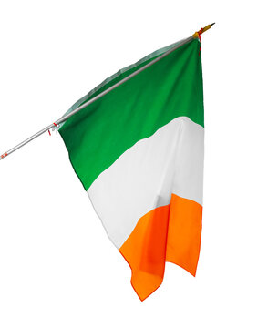 Irish flag waving in the air showing green, white, and orange colors against plain background