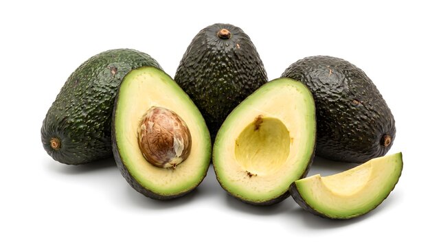 Fresh green avocados cut open showcasing pits and sliced pieces