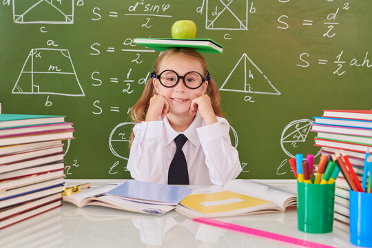 Schoolgirl Balances Books