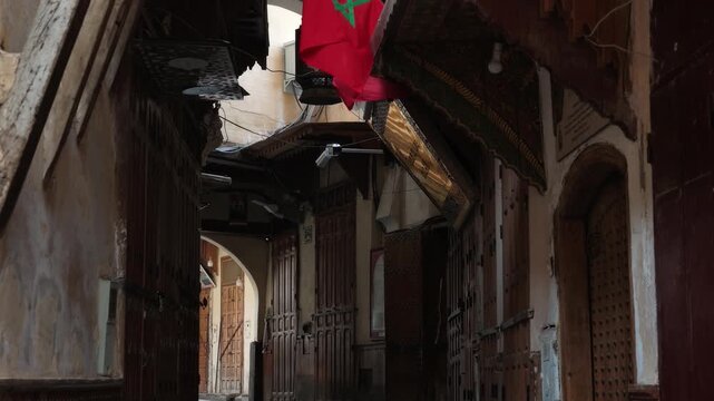narrow historic alleyways, traditional stone masonry, and ancient structural details inside the bustling medina of Fes, Morocco