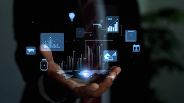 Holographic business data analytics hologram in hand, Business person holding a glowing digital hologram interface with charts animation, icons and data analytics against a dark background.