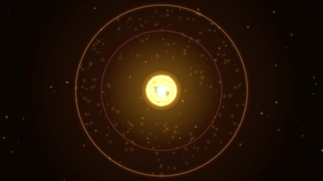 A static shot shows a bright yellow star glowing in deep space surrounded by concentric orbital rings and tiny particles, illuminated with warm golden light against a dark background