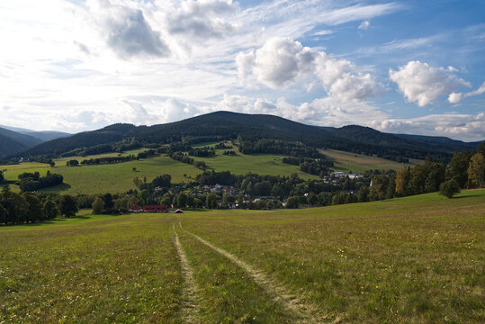 Psrt of Vrbno pod Pradedem town with Vysoka hora hill in Jeseniky mountains above in Czech republic