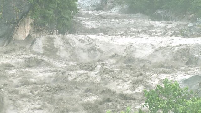 Powerful Flash Flood Sweeps Through Rocky River In Tropical Storm Tembin