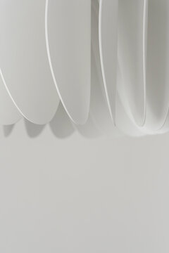 Abstract white overlapping lamellas with soft shadows and copy space
