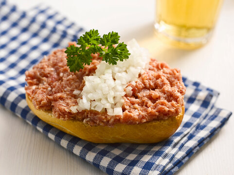 Roll with minced meat and onion, close-up