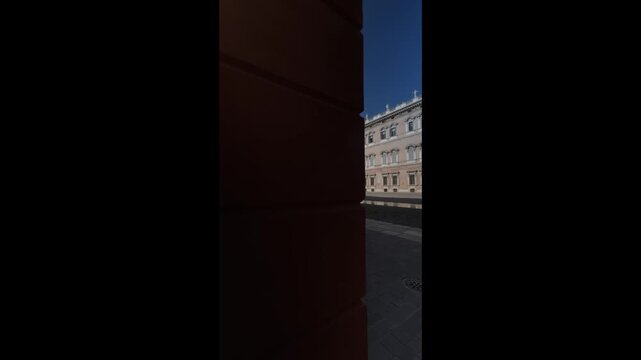 Ducal Palace in Modena, Italy, grand Baroque facade framed by arcade arches and columns, sunlit courtyard and piazza showcasing historic architecture and civic heritage
