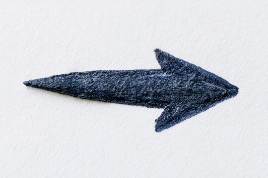 The Arrow On White Textured Surface As Minimal Directional Signage For Design