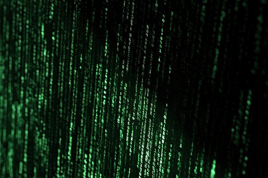 Abstract Digital Rain of Green Binary Code Descending.