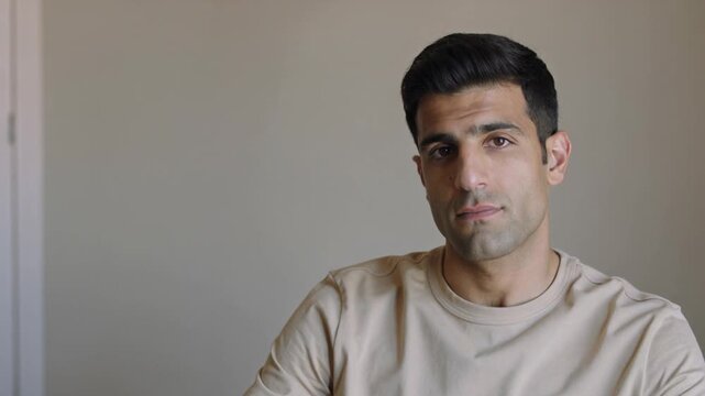 Portrait of a man against a neutral background
