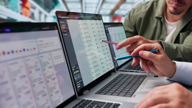 Regulatory Manager Reviews Compliance Dashboard During Client Exam Preparation