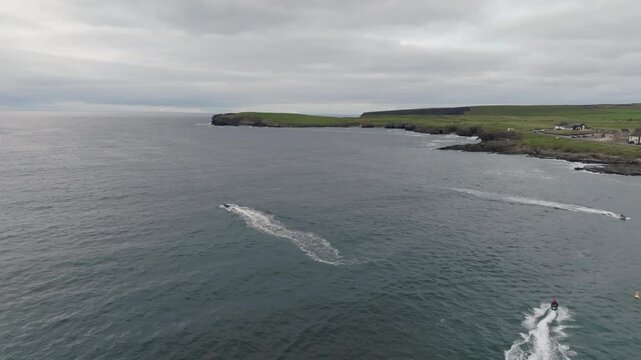 Atlantic Ocean Kilkee Ireland aerial view captures coastal town beach waterfront tourist houses marina boats and scenic landscapes popular for European travel 