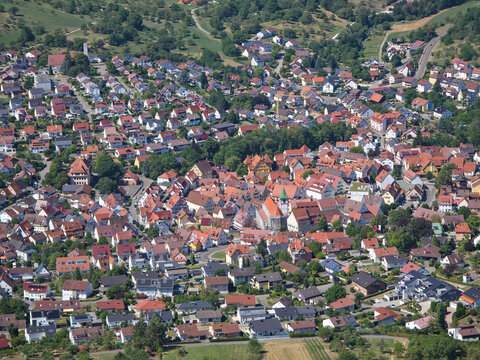 germany, spectacular aerial panorama above neuffen revealing beautiful rooftops, houses and lush green landscapes