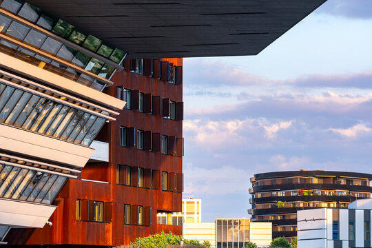 Red building in Vienna Austria at sunset creates an urban skyline where warm light shapes the building and architecture across the Vienna skyline