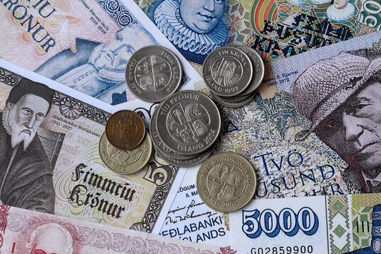 Icelandic krona money notes and coins on table. Iceland cash bills of ISK currency close up