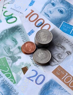 Swedish krona money notes and coins on table. Sweden cash bills of SEK currency close up