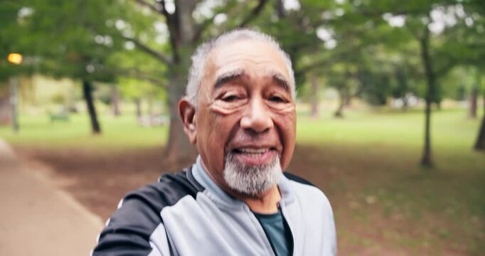 Face, selfie and old man in park for running, workout and social media post for fitness influencer. Happy, senior person and runner outdoor with live stream, content creation and vlog for exercise.