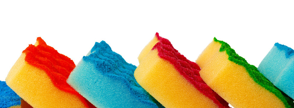 Colored sponges stacked in a row showing different vibrant colors and textures