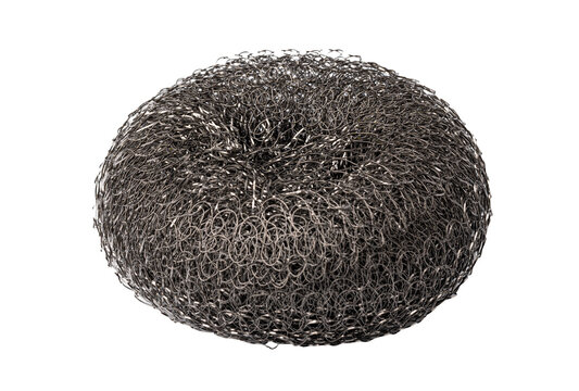 Metal scrub pad on a white background showing its round shape and texture