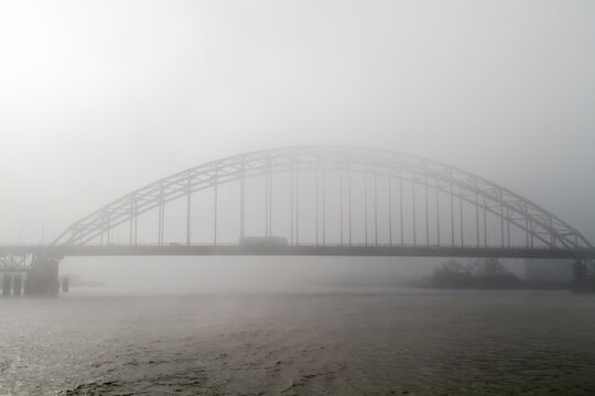 Bridge over the Noord also commonly known as the Alblasserdamsebrug or Alblasserdam Bridge in the early morning mist. It carries the N915 between Alblasserdam and Hendrik-Ido-Ambacht.