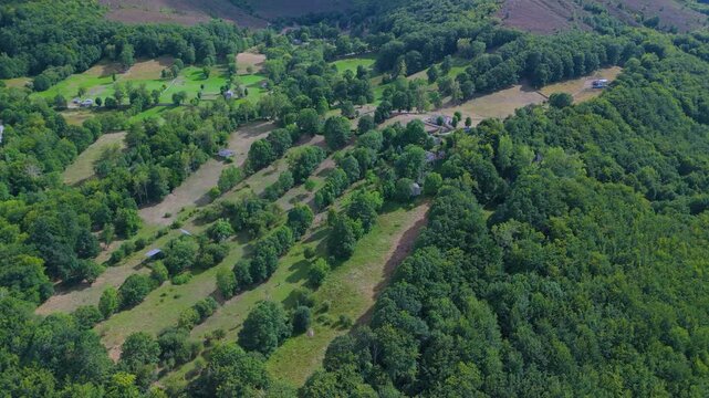Aerial drone view of the beech forest and countryside landscape in Las Machorras, Las Merindades. Pasiegos Valleys of Burgos. Castile and Le&oacute;n. Spain. Europe