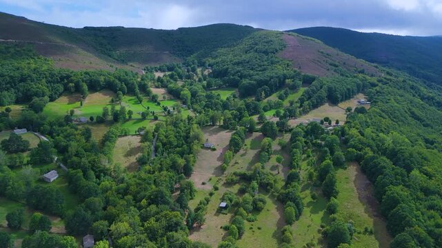Aerial drone view of the beech forest and countryside landscape in Las Machorras, Las Merindades. Pasiegos Valleys of Burgos. Castile and Le&oacute;n. Spain. Europe