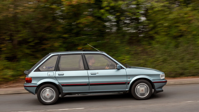 Milton Keynes; UK - Sept. 27th 2026: 1987 blue MG Maestro classic car driving on a British road