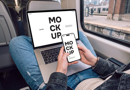 Young man using smartphone and laptop in a train mockup