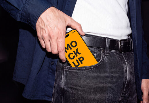 Close-up of a smartphone on jeans